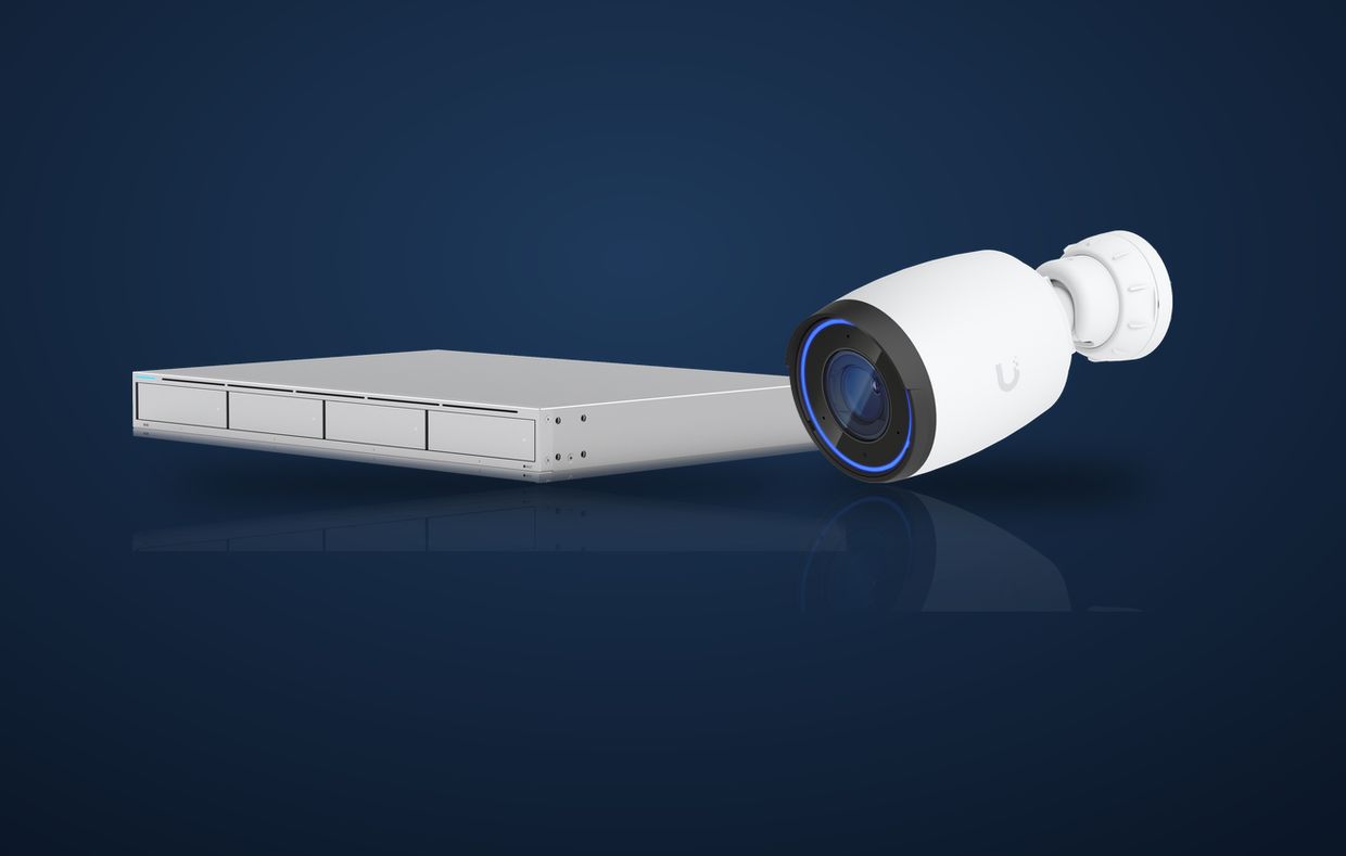 A Ubiquiti UniFi Network Video Recorder (UNVR) beside a UniFi AI Pro bullet camera